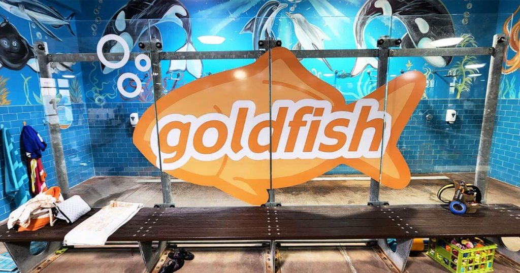  large orange fish shaped sign that says goldfish