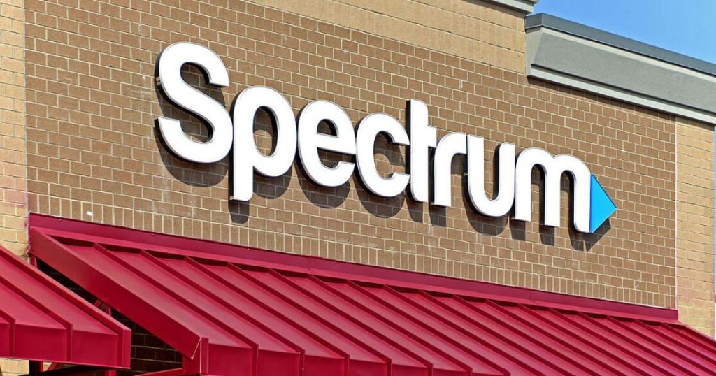  white and blue spectrum large sign above door of business