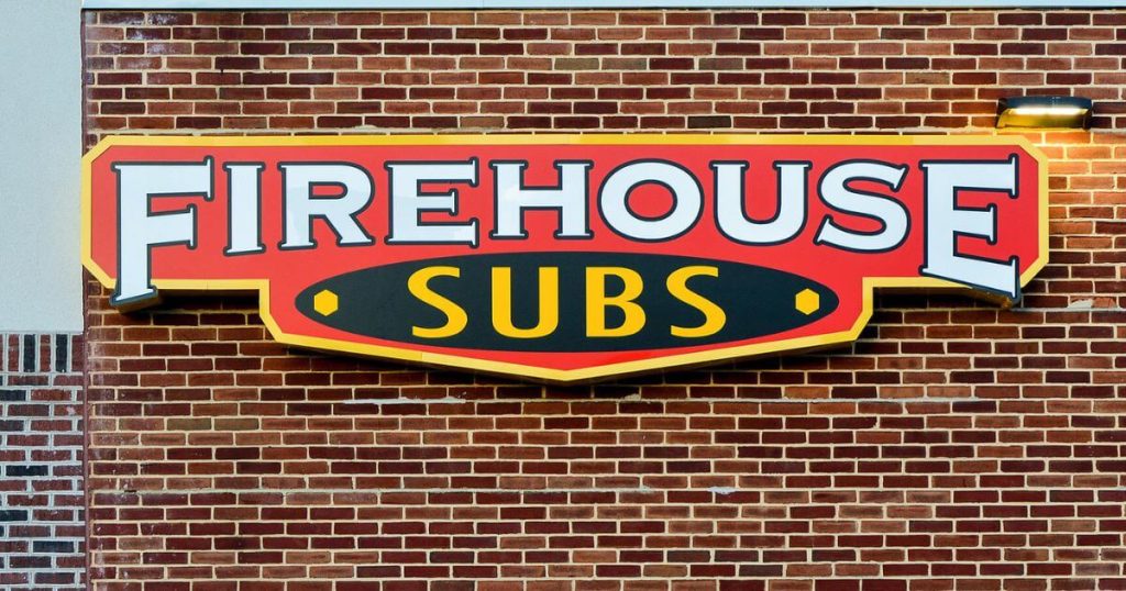 firehouse sub large sign on top of a brick building